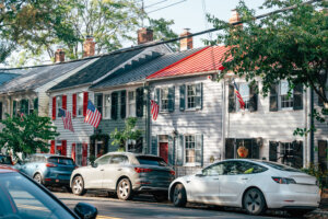 Historic street in Alexandria Virginia with charming houses and American flags adorning the facades