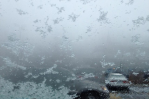 Foggy snowflakes on a windshield