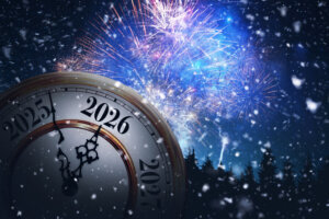 Antique clock ticks towards 2026 under a spectacular display of blue and purple fireworks