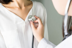 Doctor using a stethoscope for patient's examination