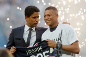 PSG President Nasser Al Khelaifi speaks to PSG's Kylian Mbappe