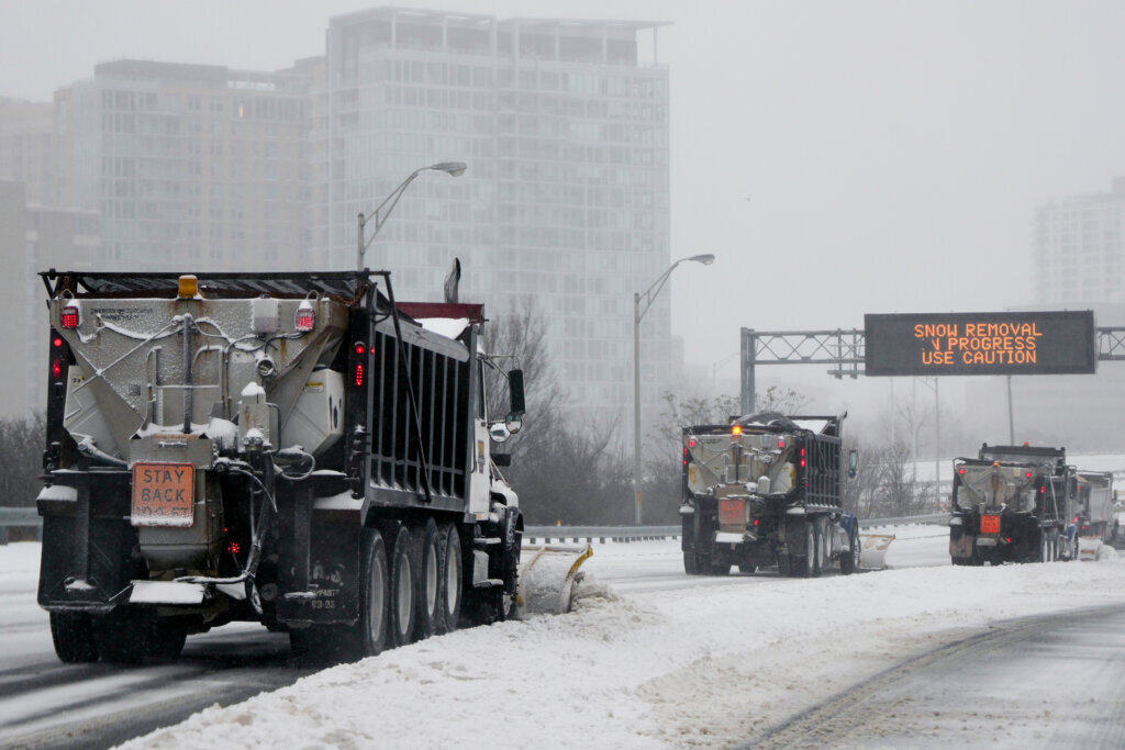 Snow plows clear Interstate 395, Sunday, Jan. 25, 2026, in Arlington, Va. (AP Photo/Julia Demaree Nikhinson)