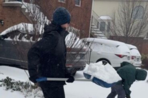Snow shoveling kids in Virginia Augenstein