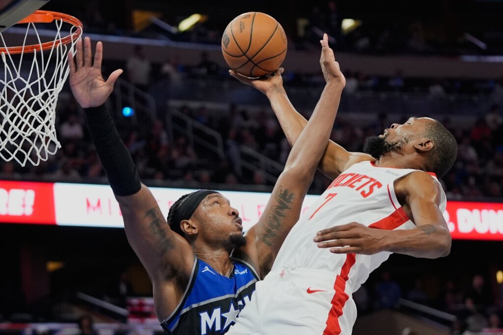 APTOPIX Rockets Magic Basketball
