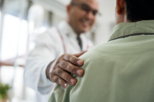 Doctors encourage patients recovery service. Doctors treat patients diseases. Life and health insurance. Advice to young man consulting about treatment