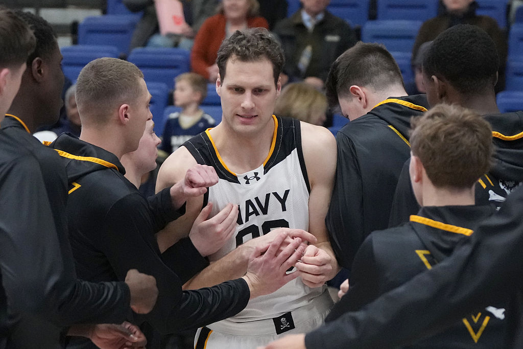 Aidan Kehoe (99) of the Navy Midshipmen is introduced before a college basketball game