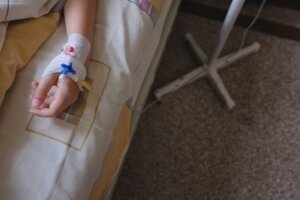 Child's hand with IV drip attached