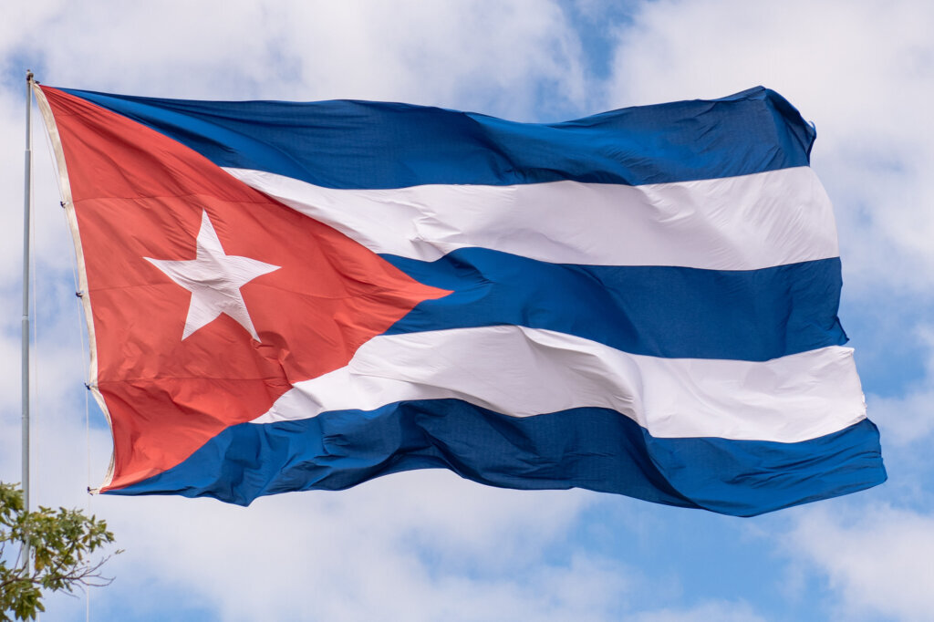 Large Cuban national flag waving during a windy day