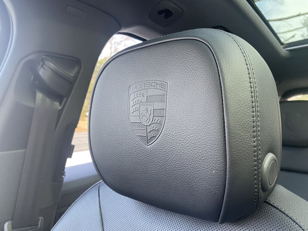 The Porsche Cayenne E‑Hybrid oozes style, right down to the Porsche logo in the headrests.
