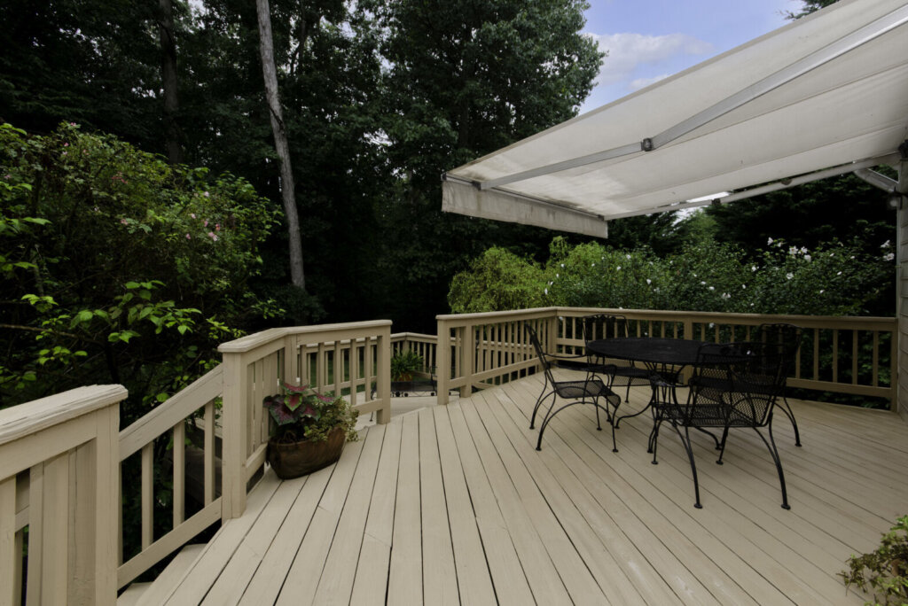 Wooden Deck with Awning and Patio Furniture
