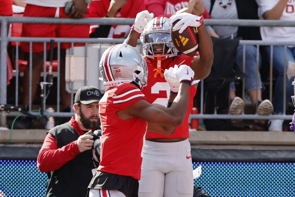 Ohio State defensive back Caleb Downs, right, celebrates after his interception against Grambling State during the first half of an NCAA college football game, Saturday, Sept. 6, 2025, in Columbus, Ohio. (AP Photo/Jay LaPrete)