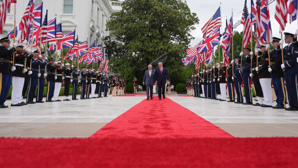 President Donald Trump walks on the red carpet in the Rose Garden with Britain's King Charles III, Queen Camilla and first lady Melania Trump at White House, Tuesday, April 28, 2026, in Washington, during a State Visit. (AP Photo/Alex Brandon)