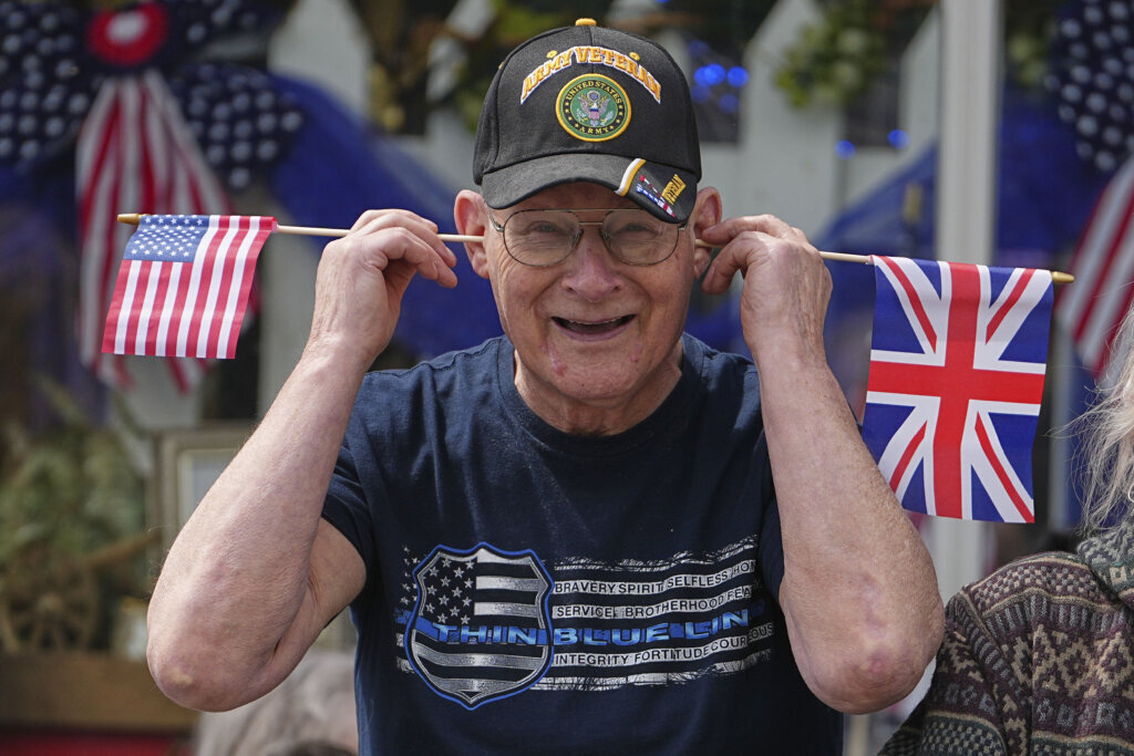 People arrive before Britain's King Charles III and Queen Camilla attend a parade in Front Royal, Va., Thursday, April 30, 2026. (AP Photo/Matt Rourke, Pool)