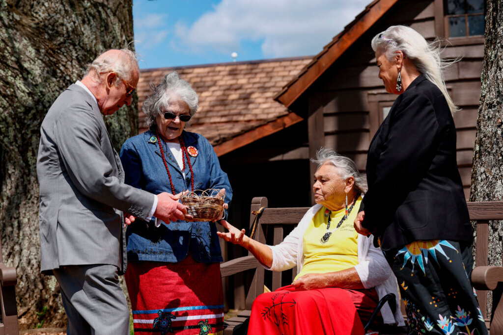 Britain's King Charles, next to Monacan chief Diane Shields, meets with tribe elder Bertie Branham during a visit to the Shenandoah National Park, Thursday, April 30, 2026, Front Royal, Virginia. (Kevin Lamarque/Pool Photo via AP)
