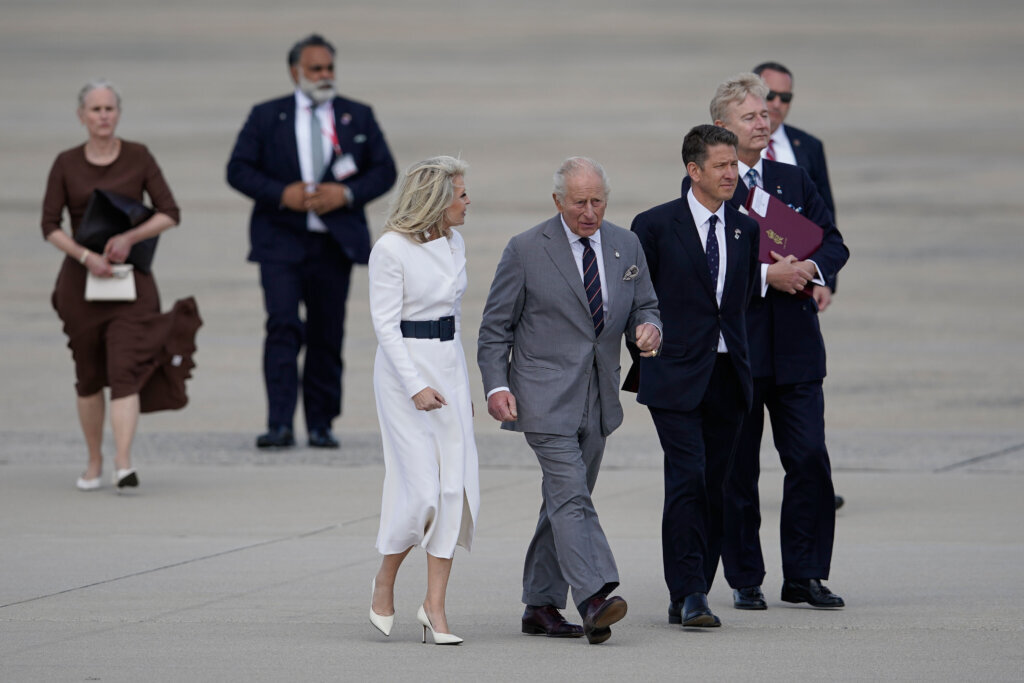 Britain's King Charles III walks from a helicopter before boarding his plane at Joint Base Andrews, Maryland, Thursday, April 30, 2026, with Monica Crowley, Chief of Protocol of the United States, left, and Britain's Ambassador to the U.S. Christian Turner. (AP Photo/Jose Luis Magana)