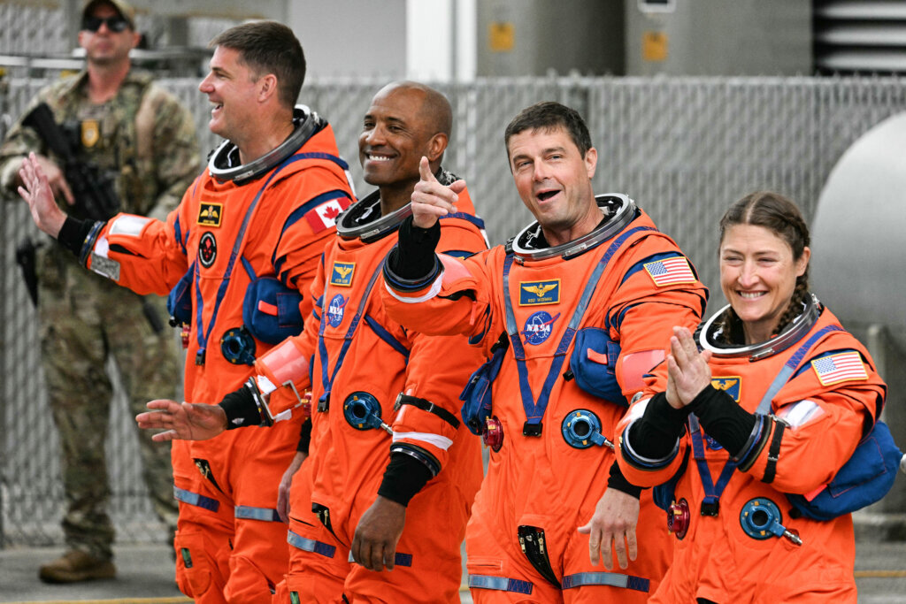 Canadian Space Agency astronaut Jeremy Hansen, Artemis II mission specialist, NASA astronauts Victor Glover, Artemis II pilot, Reid Wiseman, Artemis II commander, and Christina Koch, Artemis II mission specialist, walk out before traveling to the launch pad at Kennedy Space Center on April 1, 2026. (Photo by Jim WATSON/AFP via Getty Images)