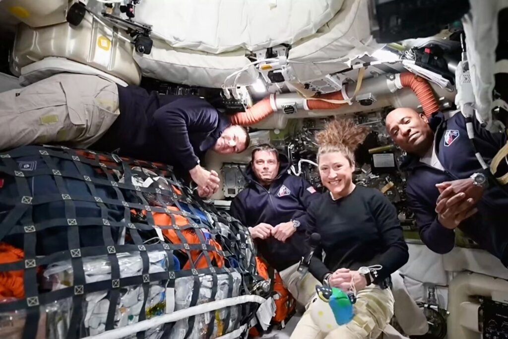 The Artemis II crew, from left, Canadian astronaut and mission specialist Jeremy Hansen, Commander Reid Wiseman, mission specialist Christina Koch and pilot Victor Glover as they speak with NASA Mission Control in a video conference while en route to the moon, Thursday, April 2, 2026. (NASA via AP)