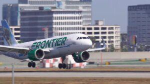 FAA investigating close call between plane and two trucks at LAX