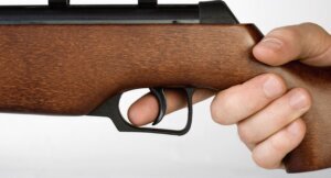 A hand holding a gun