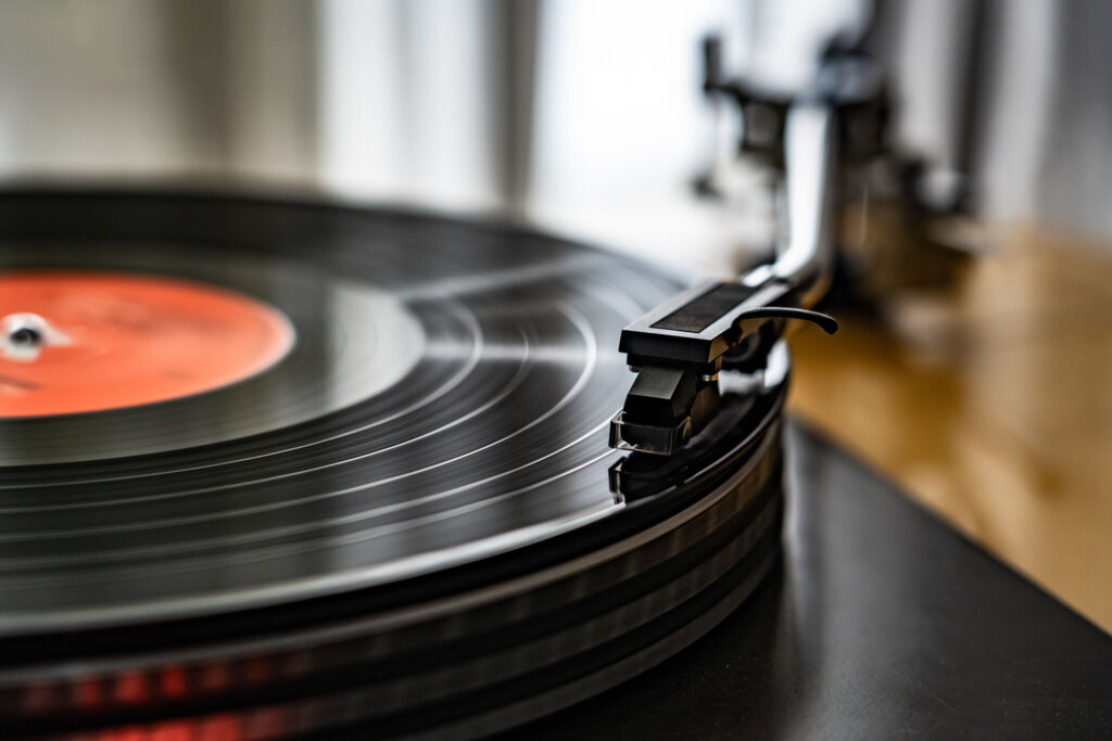 Vinyl record spins on a turntable playing music
