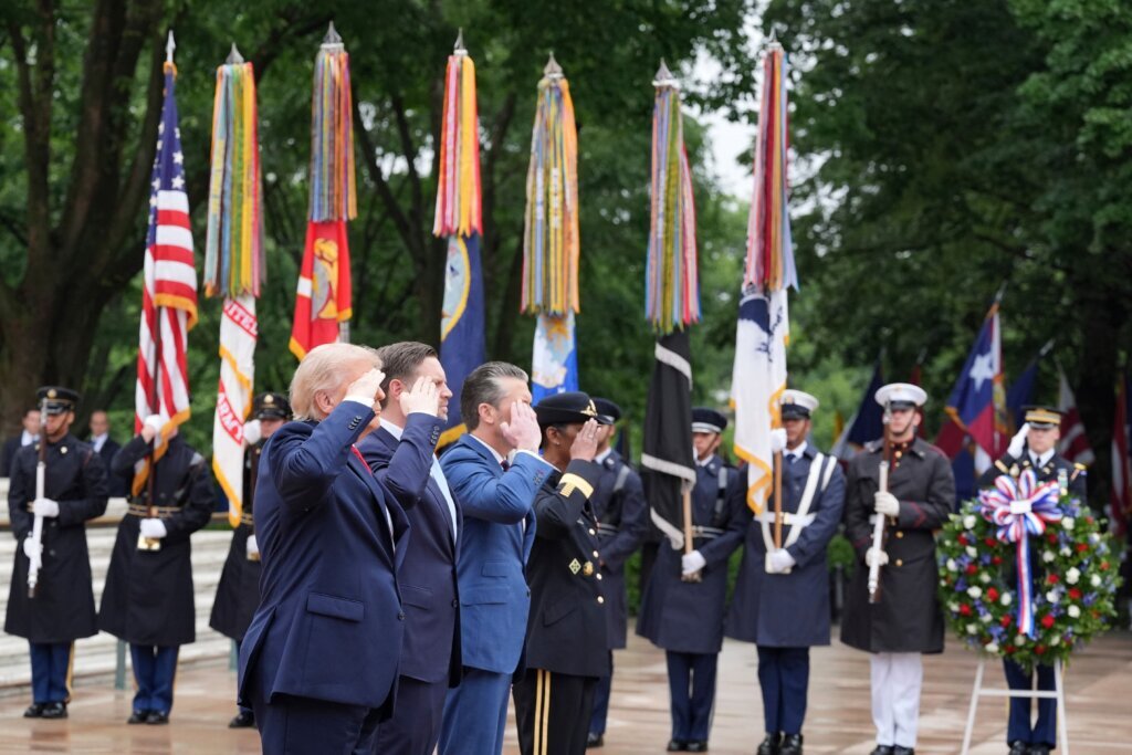 President Donald Trump salutes alongside Vice President JD Vance, Secretary of Defense Pete Hegseth and Maj. Gen. Antoinette Gant, commanding general of the Joint Task Force-National Capital Region and the U.S. Army Military District of Washington, at the Tomb of the Unknown Soldier in Arlington National Cemetery on Memorial Day, Monday, May 25, 2026, in Arlington, Virginia. (AP Photo/Alex Brandon)