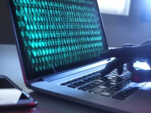 Cyber Crime, laptop computer being hacked