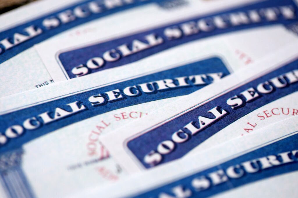 Social,Security,Number,Cards,On,Brown,Wooden,Background,Surface,Close